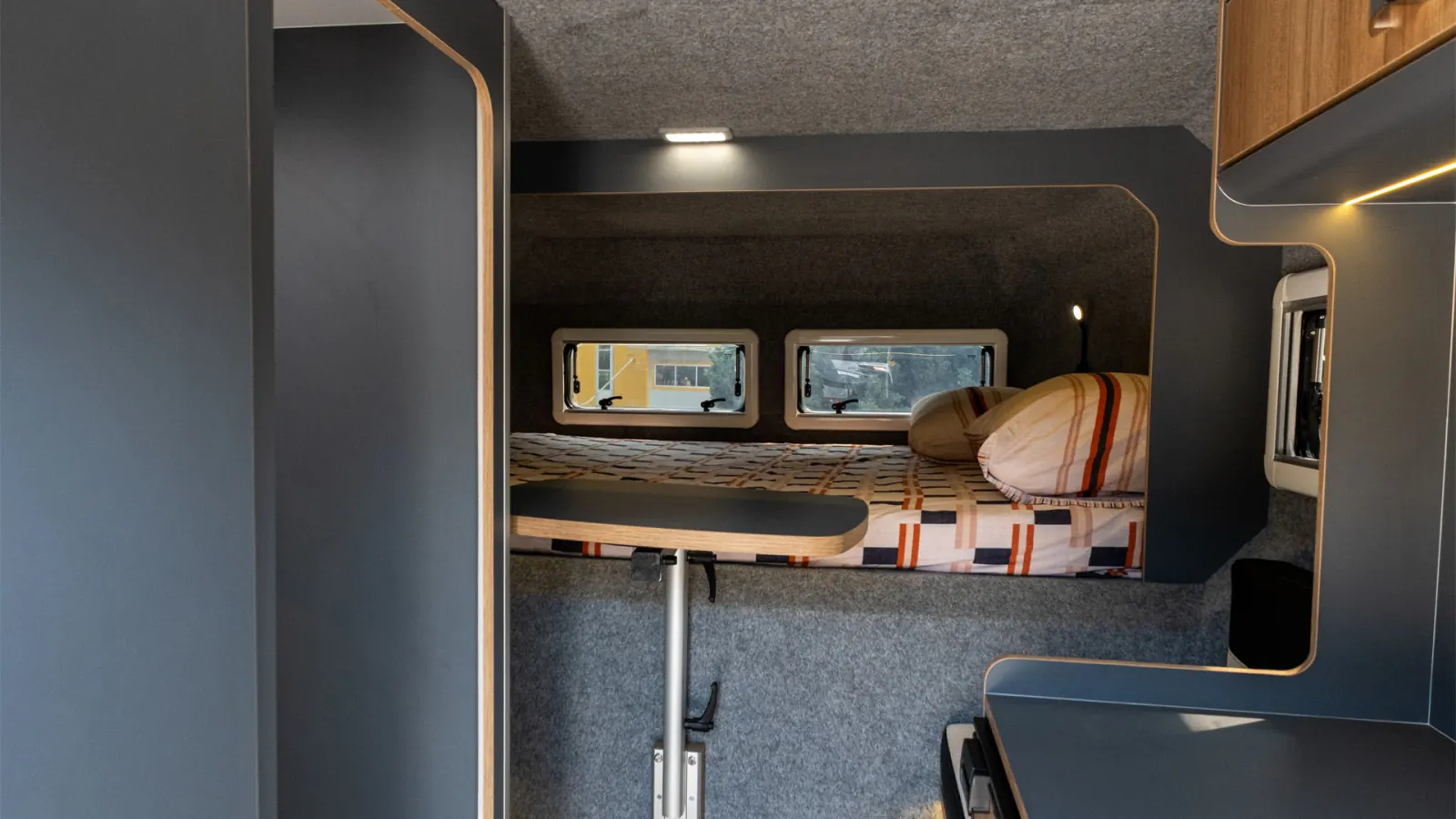 Gladiator L: main bed over the cab, dinette table below
