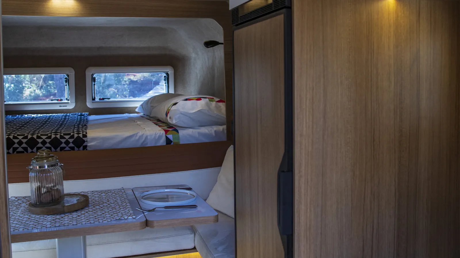 Gladiator XLE: main bed over the cab, dinette below and the tall fridge on the right